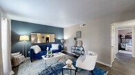 Located at 6433 Staples St in Corpus Christi, Texas, this single-story, 2-bedroom, 2-bathroom home offers a well-organized layout with comfortable living spaces throughout. The living room is a bright, welcoming area featuring hardwood-style flooring, a textured ceiling, and multiple windows dressed with gray curtains that invite natural light. A bold accent wall anchors the space, adding a distinctive design element.

The kitchen is efficiently laid out with white cabinetry, granite-style countertops, a tile backsplash, stainless steel sink, and full appliances including a refrigerator and dishwasher. Dark hardwood-style flooring carries through this area, complementing the neutral wall tones.

The primary bedroom is a generously sized retreat with vaulted ceilings, a ceiling fan, hardwood-style flooring, and access to a dedicated walk-in closet. The second bedroom offers a comfortable, functional space with neutral tones and hardwood-style floors. Both bathrooms feature granite-style countertops and tub/shower combinations, consistent with the home's clean, practical aesthetic.

Outside, a fully fenced backyard with a wooden privacy fence provides a private outdoor area, ideal for pets or recreation. The home's brick exterior adds durability and curb appeal in this Corpus Christi neighborhood.