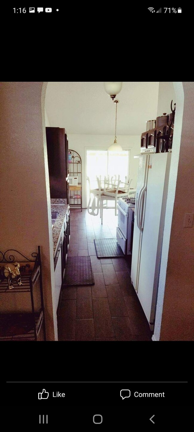 View from living room towards kitchen and back door - 5771 Sean Haggerty Dr