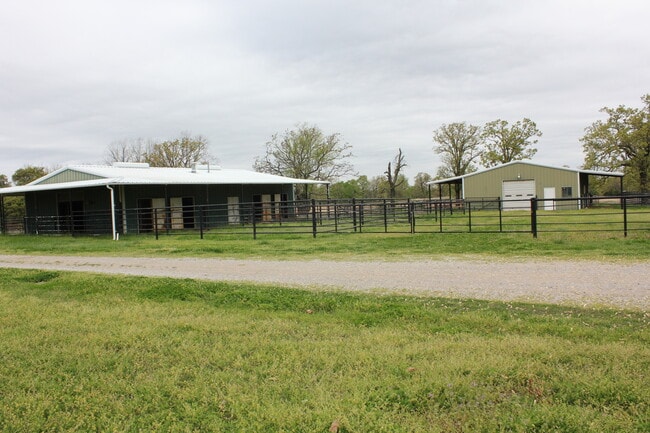Horse barns with 14 stalls, feed room, vet room, tack room - 27160 North 3990 Road