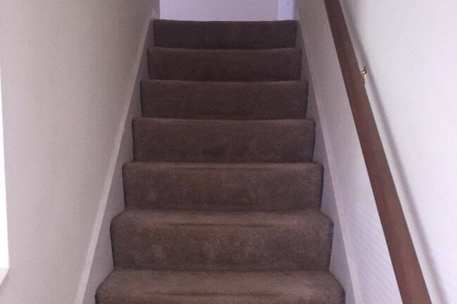 Stairs to second level. - 1375 Flintwood Dr
