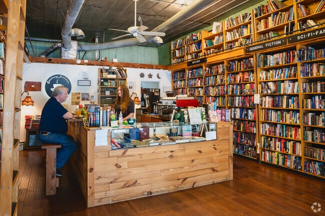 Hampton's Speakeasy Bookstore is a gem where guests can browse floor-to-ceiling shelves.