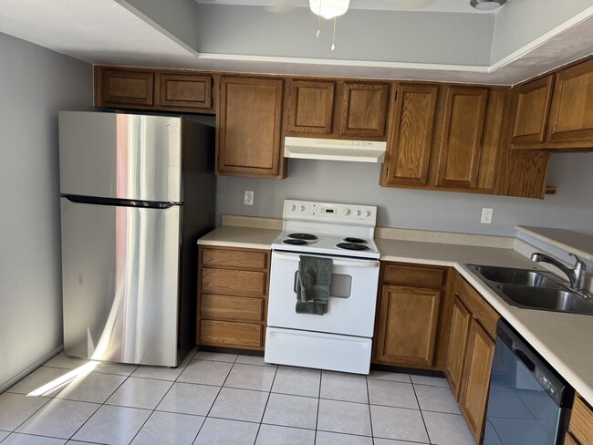 Kitchen with new refrigerator and dishwasher - 2832 E Waltann Ln