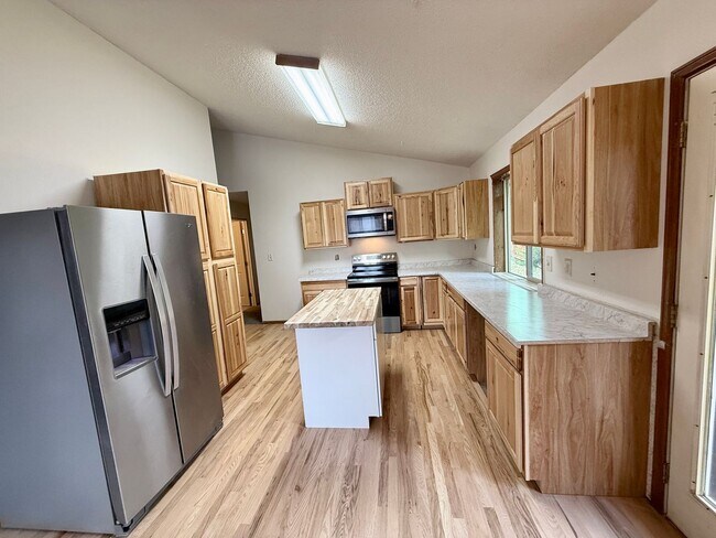 Building Photo - Beautifully Updated 5 Bedroom Rockrimmon Ranch Home Backing to Open Space