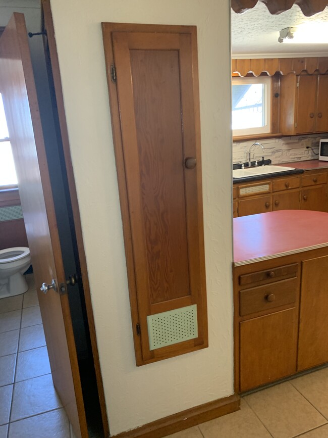 Built in ironing board - 222 W Mary St