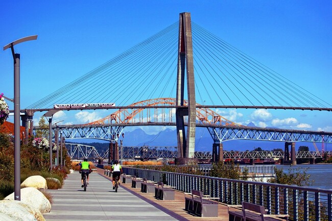 Cyclists riding along Westminster Pier Park
