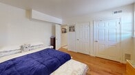 Located at 31 Peters Lane in Blackwood, NJ, this single-floor unit offers a practical and comfortable layout featuring one bedroom, two bathrooms, and a dedicated kitchen area. The space is finished with warm hardwood flooring throughout the main living and bedroom areas, complemented by light tile flooring in the kitchen and bathrooms.

The kitchen is well-equipped with warm oak cabinetry, a stainless steel gas range, an under-cabinet range hood, and a single-basin sink. A window allows natural light to brighten the space, and there is ample counter space for everyday use.

The bedroom is generously sized, featuring hardwood floors, a window for natural light, mirrored sliding closet doors that enhance the sense of space, and direct access to the bathrooms. The room accommodates a full furniture arrangement with ease.

Both bathrooms are finished with clean white tile flooring and neutral walls. One bathroom features a shower-tub combination with a curtain and a window that provides ventilation and natural light, maintaining a bright and airy feel.

A hallway connects the main living areas, featuring tile flooring and a decorative framed mirror, adding depth to the transitional space. The overall ambiance of this unit is clean, functional, and well-maintained, making it a practical residence in Blackwood, NJ.