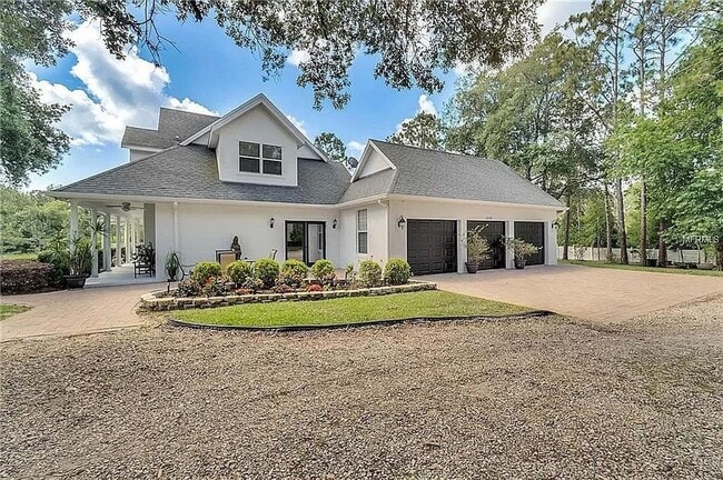 Building Photo - STUNNER! Five Acre Property in Winter Gard...