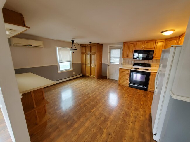 Spacious kitchen with storage, A/C in main living area for enjoyment. - 105 Belmont St