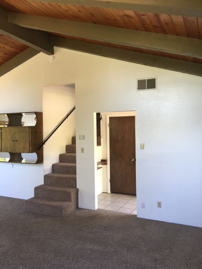 Building Photo - Downtown home with loft and exposed beam ceilings.