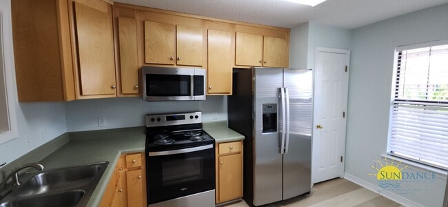 Building Photo - Charming 2-Bedroom End Unit Just Minutes f...
