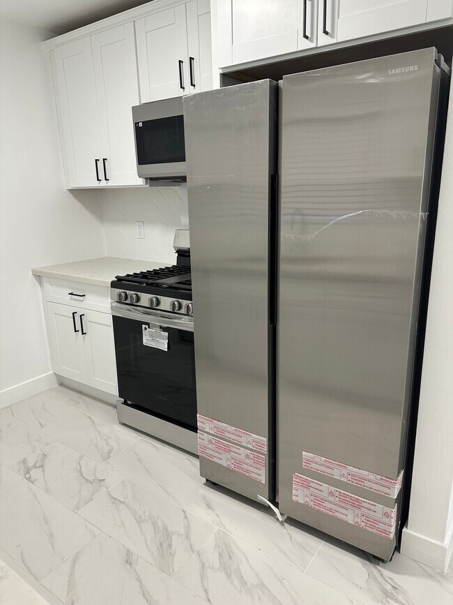 Brand New Kitchen with - All Stainless Steel, Samsung Fridge, Samsung Stove & Samsung Microwave - 1850 Camden Ave