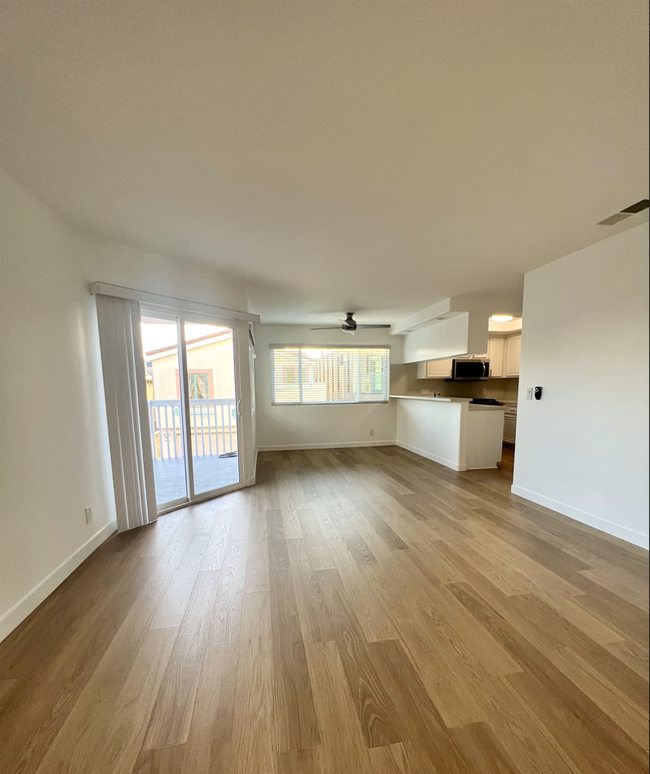 Living room, dinning area, kitchen and balcony. - 4012 Ocean Dr