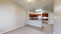 Located at 4748 Ridge Rd in North Little Rock, AR, this single-floor, 2-bedroom, 2-bathroom home offers a thoughtfully designed layout with a welcoming open-concept living and kitchen area. The living room features light wood-style flooring and a ceiling fan, creating a bright and airy atmosphere. The kitchen is well-appointed with rich wood cabinetry, dark countertops, and a full suite of stainless steel appliances including a gas range, microwave, dishwasher, and refrigerator. A charming arched nook with overhead cabinetry and a built-in desk provides a dedicated workspace or display area just off the kitchen. Both bedrooms are carpeted and include ceiling fans and ample closet space, with one bedroom featuring a double bi-fold closet and a window allowing in natural light. The two bathrooms are finished with tile flooring, dark-countered vanities with wood cabinetry, and large mirrors. Additional conveniences include a dedicated laundry area and four closets throughout. The neutral color palette and consistent finishes give the home a clean, cohesive feel from room to room.