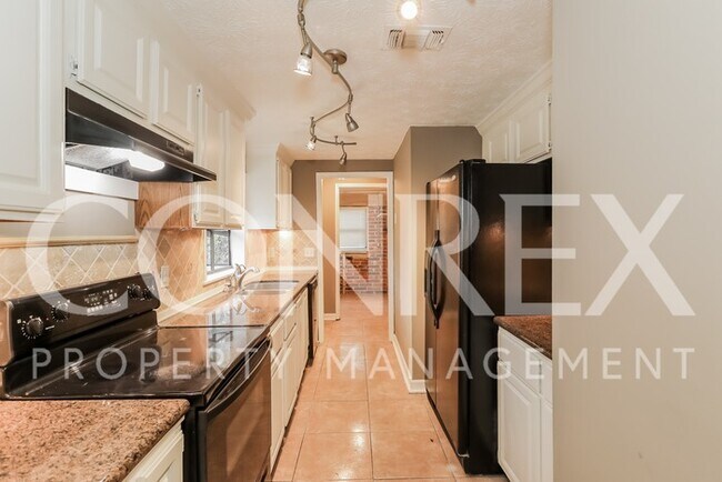 Building Photo - Charming Four Bedroom with Modern Upgrades