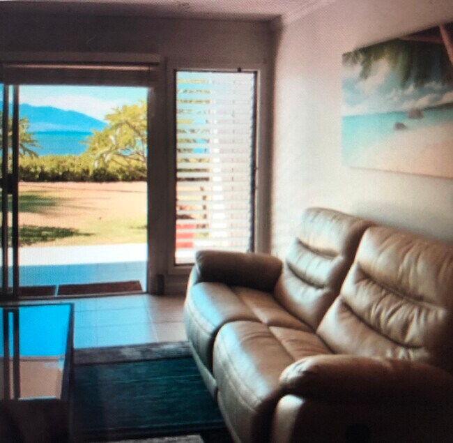 Ground floor unit with ocean steps away Views of Maui & Lanai from living room recliner - 7142 Kamehameha V Hwy