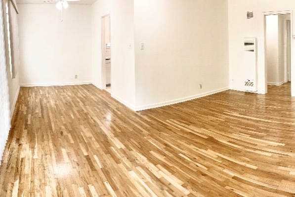 Original hardwood floors in living and dining rooms - 1234 S Westgate Ave Apartments