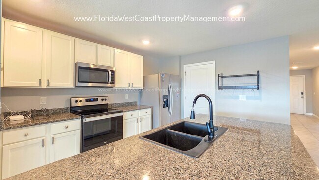 Building Photo - OUTSTANDING 3 BEDROOM/2 BATH FULLY FENCED YARD HOME AVAILABLE NOW! BELLA LAGO PARRISH!