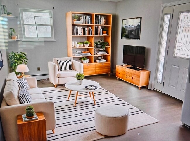 Staged photo featuring newly installed Plank hardwood flooring - 247 Bellerose Ave