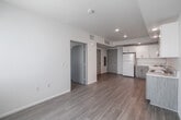 Located at 4320 44th Street in San Diego, CA, this efficiently designed one-bedroom, one-bathroom unit offers a thoughtful layout across a single floor. The open-plan living area seamlessly integrates the kitchen, dining, and living spaces into one bright, cohesive zone. Light wood-style flooring runs throughout, contributing to a clean and airy aesthetic.

The kitchen is well-equipped with white upper cabinetry featuring brushed nickel hardware, textured lower cabinets in a neutral wood-tone finish, a double-basin sink, a white electric range, and a full-size refrigerator. Recessed lighting overhead provides consistent illumination throughout the kitchen and living area, while a large window with vertical blinds fills the space with natural light.

The bedroom is a cozy, well-proportioned room with the same light flooring, neutral white walls, and a window that brings in additional natural light. Two closets offer practical storage solutions for the unit.

The bathroom is clean and functional, featuring a full bathtub with a shower, a curved shower rod, and accessibility-friendly grab bars along the walls. Light wood-tone tile flooring ties the bathroom's aesthetic to the rest of the unit. The overall palette of whites and light neutrals throughout creates a calm, move-in-ready environment.