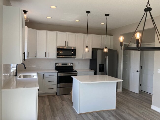 Building Photo - Spacious 4-Bedroom Home with 2-Car Garage & Yard