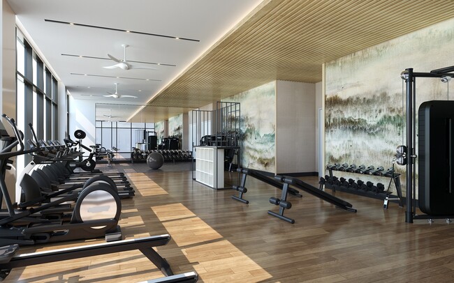 Rooftop club-quality fitness studio with Peloton bikes, TRX system, and a 270-degree view of the Atlanta skyline. - Modera Parkside