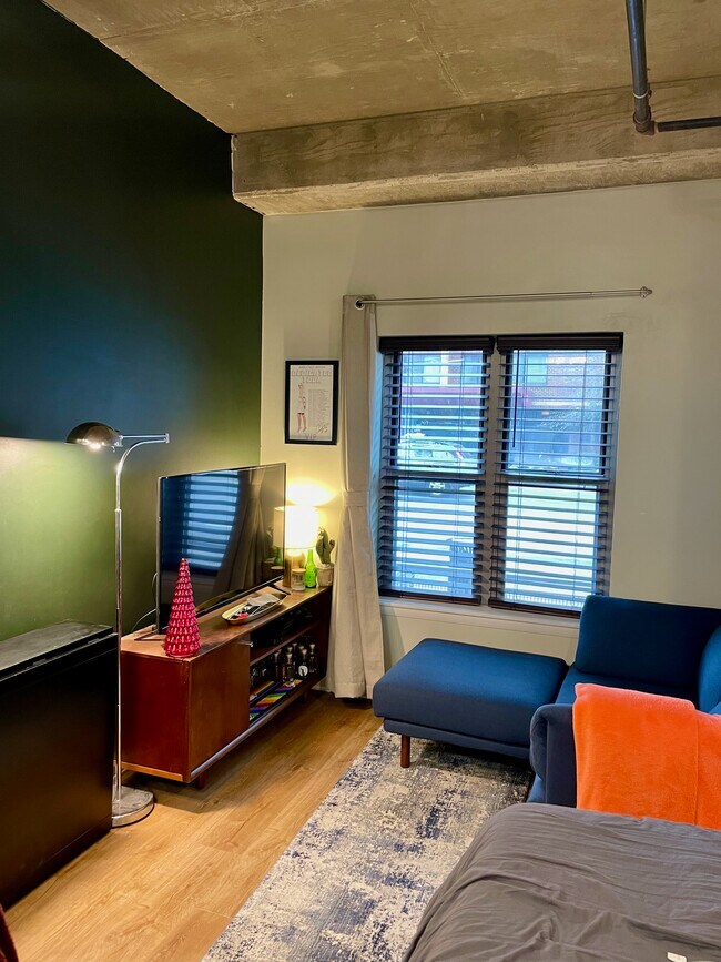 Living area with new windows and curtain rod for blackout curtains - 1300 N St NW