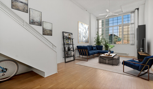 Your home has an open floorplan with large windows for natural light - The Riverloft