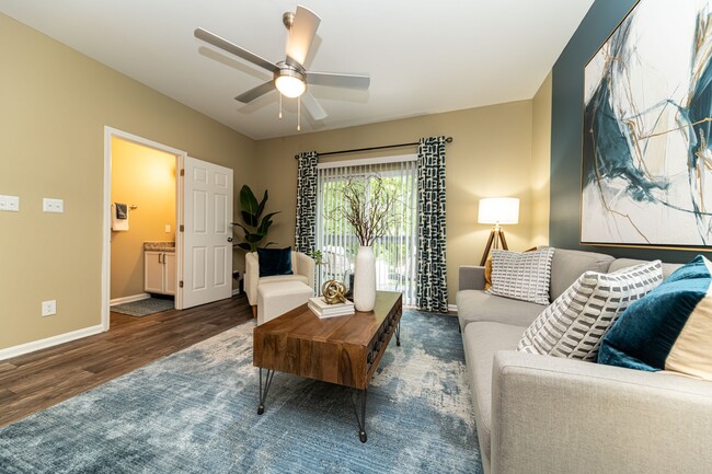 Spacious living room with hardwood-style flooring - Cooper Creek