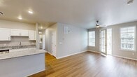 This contemporary 3-bedroom, 2-bathroom residence in Deerfield, Illinois offers 1230 square feet of thoughtfully designed living space. The heart of the home is a sleek, updated kitchen featuring crisp white cabinetry, granite countertops, and stainless steel appliances, including a built-in microwave. An island provides additional workspace and casual seating.

The spacious primary bedroom, measuring 160 square feet, ensures a comfortable retreat. Two additional bedrooms offer versatility for family members or guests. The bathrooms are modern and well-appointed, with one featuring a shower/tub combination and granite vanity top.

Throughout the home, large windows flood the rooms with natural light, while neutral wall colors create a bright, airy ambiance. The living areas boast elegant hardwood flooring, while bedrooms are carpeted for comfort. A private balcony extends the living space outdoors, offering a perfect spot for relaxation or entertaining.

Storage is ample with two dedicated closet spaces. The single-story layout enhances accessibility and flow. Located at 400 Spring Cress Road, this property combines modern design with practical living in a desirable Deerfield neighborhood.