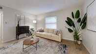 Located in Clearwater, Florida, this single-floor, two-bedroom, two-bathroom unit offers a functional and well-organized layout designed to maximize every square foot. The living room serves as the heart of the home, featuring light-toned tile flooring, a textured ceiling, and a large window that fills the space with natural light, creating a warm and inviting atmosphere. Neutral wall tones throughout contribute to a clean, cohesive aesthetic.

The combined kitchen and dining area is efficiently designed, featuring white cabinetry, white appliances including a range, microwave, dishwasher, and refrigerator, alongside a sink with a window view. Light tile flooring and ample cabinet storage make this a highly functional space. A dining area sits adjacent, providing room for everyday meals.

The primary bedroom is comfortably sized, carpeted for warmth, and includes a window for natural light. A notable feature is the in-unit stacked washer and dryer conveniently located within a closet in this room. The unit also includes three closets in total, one of which is a walk-in with wire shelving, providing generous storage options.

The bathrooms are finished with tile flooring and include a vanity with a sink, toilet, and a tub-shower combination. A hallway connects the rooms cohesively, completing this practical and comfortable Clearwater residence.