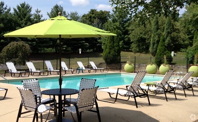 Resort-style Swimming Pool and Deck - Greenfield Apartment Homes