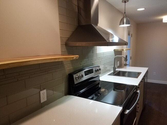 Easy clean glass backsplash and natural wood shelves - 1610 SW Freeman St