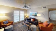 Located at 8111 N 19th Ave in Phoenix, Arizona, this single-floor residence offers a well-organized layout designed for comfortable everyday living. The galley-style kitchen is efficiently arranged with white cabinetry providing ample storage, a double-basin sink, black appliances including a refrigerator, dishwasher, and electric range, and wood-look flooring that runs throughout the common areas. An accent wall adds a subtle design element to the kitchen's interior.

Adjacent to the kitchen, the dining area features a pendant light overhead and a pass-through window that connects visually to the living space, creating an open and connected feel. The living room is bright and welcoming, highlighted by French doors that allow natural light to fill the room and a ceiling fan for year-round comfort.

The bedroom is a restful retreat with windows fitted with blinds for light control, wood-look flooring, and a textured ceiling. The full bathroom includes a vanity with storage, wood-look flooring, recessed lighting, and a shower-tub combination. Throughout the residence, neutral wall tones and consistent flooring create a cohesive and inviting atmosphere well-suited to the Phoenix lifestyle.