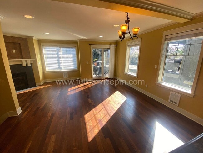Building Photo - Spacious townhome with private backyard, garage parking, multiple decks, and a dedicated home off...