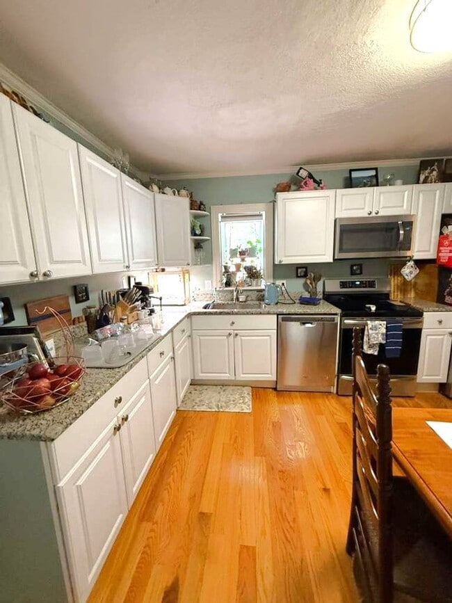 Building Photo - Spacious and updated 3-bedroom condo just 2 blocks from Airport T Station!