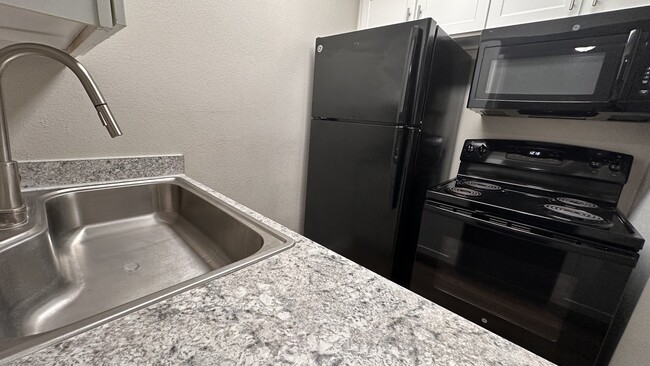 Barn-Style Sink & Updated Appliances - The Terraces on Brompton Apartments