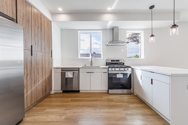 Building Photo - JUST COMPLETED MODERN TOWNHOMES! Never Liv...