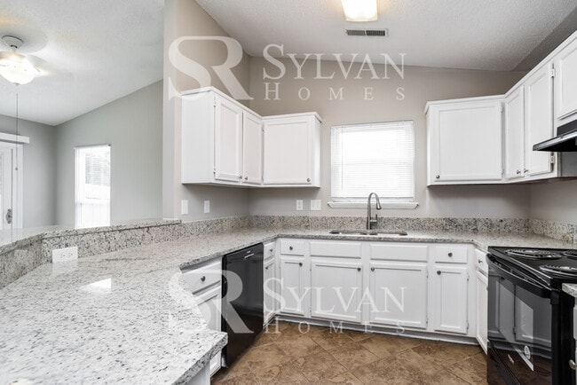 Building Photo - This home exudes a cheerful and welcoming charm!