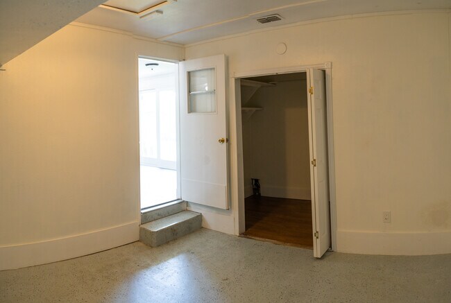 Another view of the bonus room. The door on the right leads to the laundry room. The door on the left leads to the living room - 417 Polaris Pl