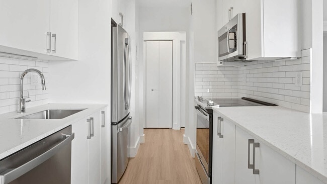 Kitchen with Stainless Steel Appliances - The Towers at Longfellow