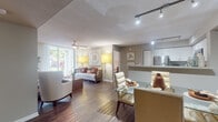 Located at 9061 SW 122nd Ave in Miami, FL, this single-floor residence offers a thoughtfully designed open-concept layout that seamlessly connects the living, dining, and kitchen areas. Rich wood-look flooring flows throughout the main living spaces, complemented by neutral-toned walls and textured ceilings fitted with ceiling fans. The living room is bathed in natural light through large sliding glass doors that frame lush outdoor greenery, creating a bright and welcoming atmosphere. Track lighting and ceiling fans provide both functional illumination and comfort throughout.

The kitchen is outfitted with stainless steel appliances, white cabinetry, granite countertops, and a subway tile backsplash, opening to the dining area via a breakfast bar — ideal for both everyday living and entertaining. A dedicated in-unit laundry closet houses a full-size washer and dryer for added convenience.

The two bedrooms are carpeted and generously sized, each featuring ceiling fans and windows that allow ample natural light. The bathroom showcases a granite vanity countertop, decorative geometric-patterned tile walls, and a full soaking tub with shower combination. This well-appointed residence offers a comfortable and functional living environment in the heart of Miami.