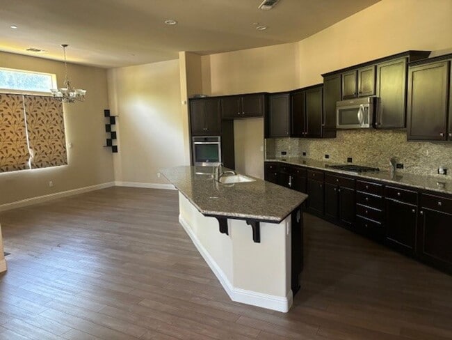 Building Photo - Elegant 4-Bedroom Home with Paid Solar in Gated Village Green Community