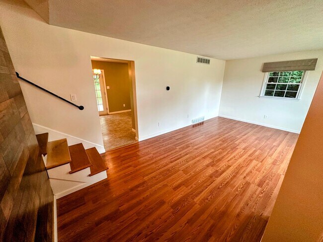Building Photo - AVAILABLE NOW! Spacious 4 BR, 2 Bath House! Wood Floors, Attached Garage, W/D Included