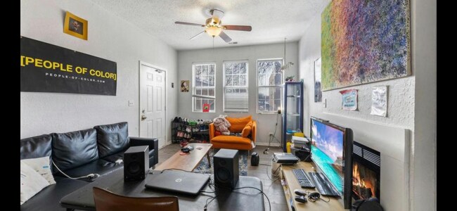 Spacious living room and dining area with fireplace - 1539 N Campbell Ave