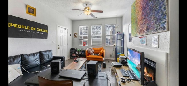 Spacious living room and dining area with fireplace - 1539 N Campbell Ave