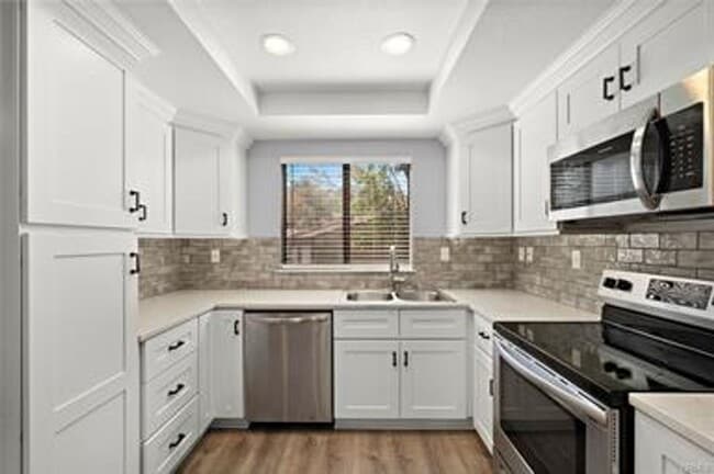 Building Photo - Beautifully Upgraded Single-Level Condo on...