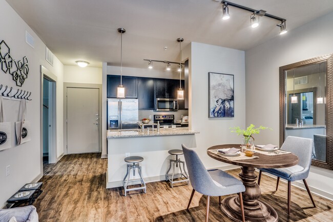 modern dining room with wood plank flooring - Junction 15