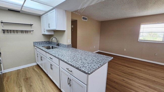 Building Photo - Annual Updated 1BR/1BA Condo – New Interior Finishes, Located on the 2nd Floor