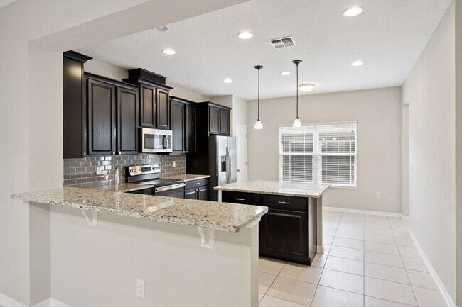 Building Photo - AVAILABLE NOW! 3/2.5/2 townhome close to Hamlin Town Center
