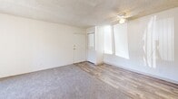Located on East Golf Links Road in Tucson, Arizona, this one-bedroom, one-bathroom unit offers a practical and efficient layout across a single floor. The living room is bright and open, featuring a mix of soft carpeting and wood-look vinyl flooring, a ceiling fan, and a sliding glass door that floods the space with natural light and provides access to the outdoors. Textured ceilings are consistent throughout the unit, adding a classic residential character.

The galley-style kitchen is thoughtfully arranged with warm oak cabinetry lining both sides, light countertops, a double-coil electric range, a refrigerator, a dishwasher, and a stainless steel sink — maximizing storage and functionality within a compact footprint.

The bedroom is carpeted and comfortably sized, featuring a large window that invites natural light and offers exterior views. A full-sized closet with bi-fold doors provides ample storage space.

The bathroom includes a tub-shower combination with a curtain, a wood-toned vanity with an integrated sink, and wood-look flooring that ties cohesively to the rest of the unit.

Overall, the unit presents a clean, neutral palette throughout, making it a versatile and move-in ready space well-suited for those seeking a streamlined, low-maintenance living environment in Tucson.